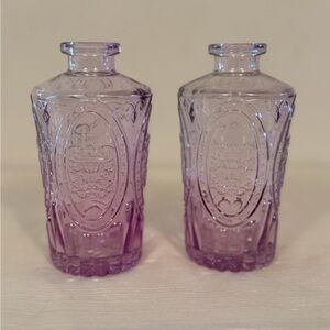 Small purple embossed glass bud vases